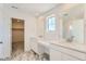 Stylish bathroom featuring marble floors, dual sinks and a vanity area at 10984 Snowdon St, Parker, CO 80134