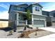 Beautiful two-story home with a two-car garage, covered front porch, and tastefully landscaped front yard at 10984 Snowdon St, Parker, CO 80134