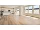 Bright open floor plan featuring hardwood floors, large windows and abundant natural light at 10984 Snowdon St, Parker, CO 80134