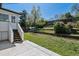 Charming backyard featuring tiered landscaping and a lush lawn at 13472 W Dakota Ave, Lakewood, CO 80228