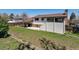 Exterior view of home highlighting the covered patio and backyard space at 13472 W Dakota Ave, Lakewood, CO 80228