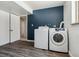 Efficient laundry room area with modern front load washer and dryer at 13472 W Dakota Ave, Lakewood, CO 80228