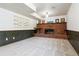 Spacious living room with a brick fireplace and decorative accents at 13472 W Dakota Ave, Lakewood, CO 80228