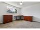 Bright office with wooden desk, filing cabinets and plush carpet at 13472 W Dakota Ave, Lakewood, CO 80228
