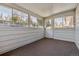 Enclosed sunroom with windows and a door leading to the outside at 13472 W Dakota Ave, Lakewood, CO 80228
