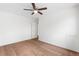 A bedroom with wood floors, white walls, a ceiling fan, and a closet at 9320 Fir Dr, Thornton, CO 80229