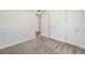 Clean bedroom featuring carpet, neutral walls, and a closet for seamless organization at 9320 Fir Dr, Thornton, CO 80229