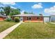 Charming brick home with a well-maintained lawn and attached garage at 9320 Fir Dr, Thornton, CO 80229