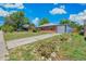 A charming brick house with attached garage and driveway under a blue sky at 9320 Fir Dr, Thornton, CO 80229