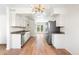 Updated kitchen featuring granite counters, new stainless steel appliances, and wood floors at 9320 Fir Dr, Thornton, CO 80229