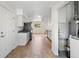 Updated kitchen featuring granite counters, new stainless steel appliances, and wood floors at 9320 Fir Dr, Thornton, CO 80229