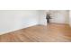 Bright living room with new wood floors, fresh white paint, and an open layout at 9320 Fir Dr, Thornton, CO 80229