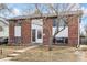 Charming two-story brick home featuring a well-manicured front yard and a welcoming entrance at 3310 W Mountain Rd, Englewood, CO 80110