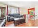 Bright living room with hardwood floors, large window, modern furniture, and decorative accents at 3310 W Mountain Rd, Englewood, CO 80110