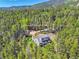 Secluded mountain home surrounded by lush forest, offering privacy and scenic views at 9092 Gray Ln, Conifer, CO 80433