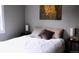 Comfortable bedroom featuring a plush bed, stylish decor, and ample lighting at 9092 Gray Ln, Conifer, CO 80433
