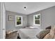 Comfortable bedroom featuring hardwood floors and picturesque backyard views at 9092 Gray Ln, Conifer, CO 80433