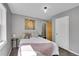 Comfortable bedroom featuring hardwood floors and ensuite bathroom access at 9092 Gray Ln, Conifer, CO 80433