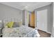 Cozy bedroom featuring hardwood floors and a charming white metal bed frame at 9092 Gray Ln, Conifer, CO 80433