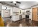 Bright kitchen features white cabinets, stainless steel appliances, subway tile backsplash, and hardwood floors at 9092 Gray Ln, Conifer, CO 80433