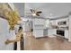 Stylish kitchen with white cabinets, granite countertops, subway tile backsplash and stainless steel appliances at 9092 Gray Ln, Conifer, CO 80433