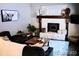 Cozy living room with an inviting fireplace and comfortable seating at 9092 Gray Ln, Conifer, CO 80433