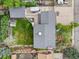 Birds eye view of a home's roof, backyard, and patio, showcasing the property's layout and outdoor space at 2210 Miller St, Lakewood, CO 80215