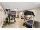 Basement features workout equipment and a fireplace at 2210 Miller St, Lakewood, CO 80215
