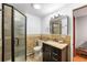 Cozy bathroom with shower, tile floors and vanity at 2210 Miller St, Lakewood, CO 80215