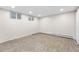 This empty bedroom offers hardwood-style flooring, recessed lighting, and an egress window at 2210 Miller St, Lakewood, CO 80215
