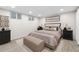 This bedroom boasts neutral decor, recessed lights, an egress window, and new carpet at 2210 Miller St, Lakewood, CO 80215