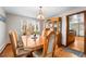 Formal dining room featuring hardwood floors and a view into the updated kitchen at 2210 Miller St, Lakewood, CO 80215