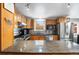 Bright kitchen featuring stainless steel appliances, granite countertops, and wood cabinets at 2210 Miller St, Lakewood, CO 80215