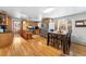 Open kitchen with stainless steel appliances, granite countertops, and hardwood floors at 2210 Miller St, Lakewood, CO 80215