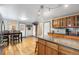 Bright eat-in kitchen featuring stainless steel appliances and hardwood floors at 2210 Miller St, Lakewood, CO 80215