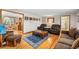 A warm and inviting living room with hardwood floors and comfortable seating at 2210 Miller St, Lakewood, CO 80215
