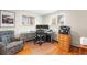Home office space with dual monitors, natural light, and comfortable seating at 2210 Miller St, Lakewood, CO 80215