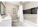 Bathroom with a white vanity, mirror and a shower and bathtub combination at 1392 W Caley Ave, Littleton, CO 80120