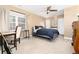 Cozy bedroom with carpet, ceiling fan, closet and bright window with a work desk at 1392 W Caley Ave, Littleton, CO 80120