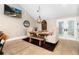 Dining room with a wooden table, two upholstered chairs and a wooden bench on a Persian rug at 1392 W Caley Ave, Littleton, CO 80120