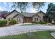 Charming single-story home featuring professional landscaping, decorative rock and inviting curb appeal at 1392 W Caley Ave, Littleton, CO 80120