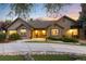 Charming single-story home featuring professional landscaping, decorative rock and inviting curb appeal at 1392 W Caley Ave, Littleton, CO 80120