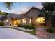 Charming single-story home featuring professional landscaping, decorative rock and inviting curb appeal at 1392 W Caley Ave, Littleton, CO 80120