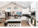 Beautiful kitchen features white cabinetry, large island, and stainless appliances at 1392 W Caley Ave, Littleton, CO 80120