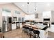 Elegant kitchen with modern stainless steel appliances, and a central kitchen island at 1392 W Caley Ave, Littleton, CO 80120