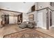 Living room with beautiful hardwood floors and accent wall and decor at 1392 W Caley Ave, Littleton, CO 80120