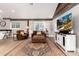 Living room with rustic charm and a decorative ceiling with lots of natural light at 1392 W Caley Ave, Littleton, CO 80120