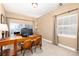 Office with desk, office chair, beige carpet and large window at 1392 W Caley Ave, Littleton, CO 80120