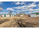 Expansive backyard featuring multiple outbuildings offers ample space and versatility for various outdoor activities and storage at 13581 Sable Blvd, Brighton, CO 80601