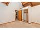 Bedroom with mirrored closet and access to bath at 13581 Sable Blvd, Brighton, CO 80601